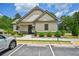 Charming clubhouse exterior with well-maintained landscaping and ample parking at 4189 Brookmont Way, Auburn, GA 30011