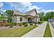 Exterior perspective of a well-kept clubhouse with manicured lawn at 4189 Brookmont Way, Auburn, GA 30011
