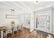 Bright dining room with wood floors, white wainscoting and a stylish light fixture at 4189 Brookmont Way, Auburn, GA 30011