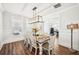 Elegant dining room with hardwood floors, wainscoting, and an inviting atmosphere for gatherings at 4189 Brookmont Way, Auburn, GA 30011