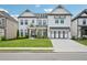 Charming two-story home with a well-manicured lawn and a classic white facade at 4189 Brookmont Way, Auburn, GA 30011