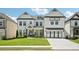Beautiful two-story home with a manicured lawn, long driveway and welcoming curb appeal at 4189 Brookmont Way, Auburn, GA 30011