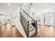 Inviting foyer with wood floors, a staircase, and a view of other rooms at 4189 Brookmont Way, Auburn, GA 30011