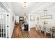 Spacious foyer with wood floors, a dining area, staircase, and access to other rooms at 4189 Brookmont Way, Auburn, GA 30011