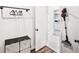 Hallway features a rack with hangers, storage containers, and a modern vacuum cleaner at 4189 Brookmont Way, Auburn, GA 30011