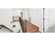 Bright hallway with hardwood floors, a wrought iron banister, and views of the home's elegant interior at 4189 Brookmont Way, Auburn, GA 30011