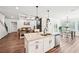 Open concept kitchen with island flowing to the living room and dining area at 4189 Brookmont Way, Auburn, GA 30011