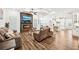 Spacious living room with hardwood floors, fireplace, and coffered ceilings offers comfort and style at 4189 Brookmont Way, Auburn, GA 30011