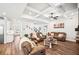 Inviting living room featuring hardwood floors, coffered ceilings, and a cozy seating area at 4189 Brookmont Way, Auburn, GA 30011