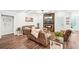 Comfortable living room with hardwood floors, fireplace, and an abundance of natural light at 4189 Brookmont Way, Auburn, GA 30011