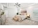 Spacious bedroom with bench, tray ceiling and neutral color palette at 4189 Brookmont Way, Auburn, GA 30011