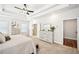 Bright bedroom with tray ceiling, carpeted floors, and natural light from multiple windows at 4189 Brookmont Way, Auburn, GA 30011