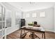 Bright office space with hardwood floors, ample natural light, and a sleek, modern desk perfect for working from home at 4189 Brookmont Way, Auburn, GA 30011