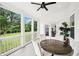 Screened-in porch provides a serene view of the backyard with a table and chairs for relaxed outdoor living at 4189 Brookmont Way, Auburn, GA 30011