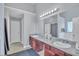 Bright bathroom with double sinks, large mirror, and modern lighting at 4240 N Braves Cir, Douglasville, GA 30135