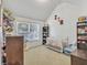 Cozy bedroom with natural light, decorated with stuffed animals and a crib for a  at 4240 N Braves Cir, Douglasville, GA 30135