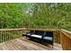 View of wood deck with chairs and view of the surrounding nature at 4240 N Braves Cir, Douglasville, GA 30135