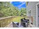 Cozy wood deck with patio furniture offers an inviting outdoor space at 4240 N Braves Cir, Douglasville, GA 30135