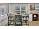 Dining area with a large table and a window providing natural light at 4240 N Braves Cir, Douglasville, GA 30135