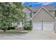 Two-story house with two-car garage, well-maintained landscaping, and inviting front entrance at 4240 N Braves Cir, Douglasville, GA 30135