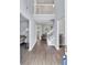 Bright and airy foyer with hardwood floors, staircase, and views to other living areas at 4240 N Braves Cir, Douglasville, GA 30135