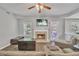 Cozy living room with a fireplace, TV, and comfortable seating at 4240 N Braves Cir, Douglasville, GA 30135