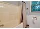 Bright bathroom showcasing a clean, tiled bathtub with a shower curtain and natural light at 224 Amy Blvd, Temple, GA 30179