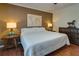 Comfortable bedroom showcasing hardwood floors, natural light, and warm wall colors at 224 Amy Blvd, Temple, GA 30179