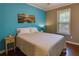 Comfortable bedroom features an accent wall, hardwood floors and a large bed at 224 Amy Blvd, Temple, GA 30179