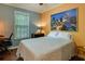Cozy bedroom featuring a comfortable bed, striking artwork, and ample natural light at 224 Amy Blvd, Temple, GA 30179