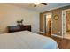 Bright bedroom with hardwood floors and closet with view of ensuite bathroom at 224 Amy Blvd, Temple, GA 30179