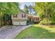 Charming home featuring a well-manicured lawn, two-car garage, and inviting front porch at 224 Amy Blvd, Temple, GA 30179
