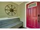 Close-up of the red front door with decorative accents and a compass star wall decoration at 224 Amy Blvd, Temple, GA 30179