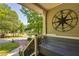 Cozy front porch featuring a bench, decorative compass, and a view of the neighborhood at 224 Amy Blvd, Temple, GA 30179