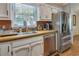 Kitchen with stainless steel appliances, wood countertops, and a view from the window at 224 Amy Blvd, Temple, GA 30179