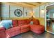 Inviting sunroom featuring a brick accent wall, wood ceiling, and comfortable seating at 224 Amy Blvd, Temple, GA 30179