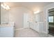 Elegant bathroom featuring dual vanities, modern fixtures, and tile flooring at 3405 Linstead Ct, Loganville, GA 30052