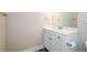 Bright bathroom featuring white vanity, modern fixtures, and a minimalist design at 3405 Linstead Ct, Loganville, GA 30052