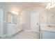 Bright bathroom boasting dual vanities, quartz countertops, and neutral tones at 3405 Linstead Ct, Loganville, GA 30052