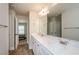 Bright bathroom featuring a double vanity with modern finishes and a large mirror at 3405 Linstead Ct, Loganville, GA 30052