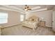 Spacious primary bedroom with tray ceiling, neutral decor, and carpeted floors at 3405 Linstead Ct, Loganville, GA 30052