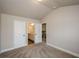 Spacious bedroom with neutral walls and carpet and access to a full bathroom at 3405 Linstead Ct, Loganville, GA 30052