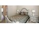 Comfortable bedroom with neutral decor, an upholstered headboard, and side tables with lamps at 3405 Linstead Ct, Loganville, GA 30052