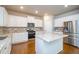 Modern kitchen featuring a center island, stainless appliances, and granite counters at 3405 Linstead Ct, Loganville, GA 30052