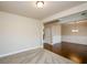 Bright living room features plush carpet, neutral walls, and entryway to dining area at 3405 Linstead Ct, Loganville, GA 30052