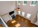 Open-concept living room with fireplace, built-in shelves, and plenty of natural light at 3405 Linstead Ct, Loganville, GA 30052