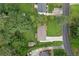 Birds eye view of the house featuring a long drive way, backyard, wooden deck, and storage shed at 470 Pretty View Se Ln, Smyrna, GA 30082