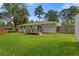 Expansive backyard view with a deck, well-maintained lawn, and a shed on the property at 470 Pretty View Se Ln, Smyrna, GA 30082