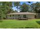 A large backyard with a wooden deck and a storage shed, perfect for outdoor relaxation and storage at 470 Pretty View Se Ln, Smyrna, GA 30082