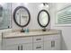 Bathroom featuring double sinks, granite countertops, and updated fixtures at 470 Pretty View Se Ln, Smyrna, GA 30082
